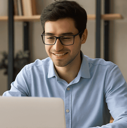 Smiling student using a laptop for online study‑abroad guidance