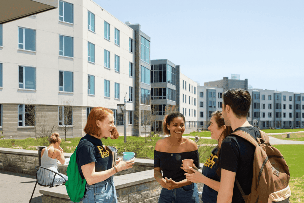 Study abroad students enjoying conversation in a university residential area.